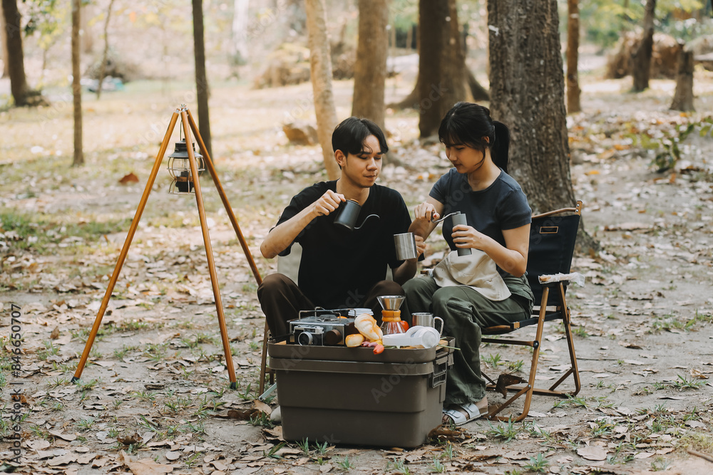 Asian couple sweet in tent inside on they camping trip, traveller relax and sleep togather in out door and camping trip Asian couple sweet in tent inside on they camping trip, traveller relax and sleep togather in out door and camping trip