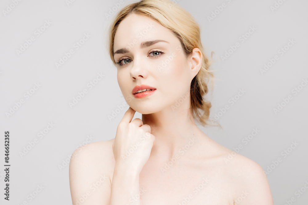 Close-up portrait of a charming half-naked woman in the studio. Portrait of a charming, sensual blonde on a light background. Cosmetology concept. Close-up portrait of a charming half-naked woman in the studio. Portrait of a charming, sensual blonde on a light background. Cosmetology concept.