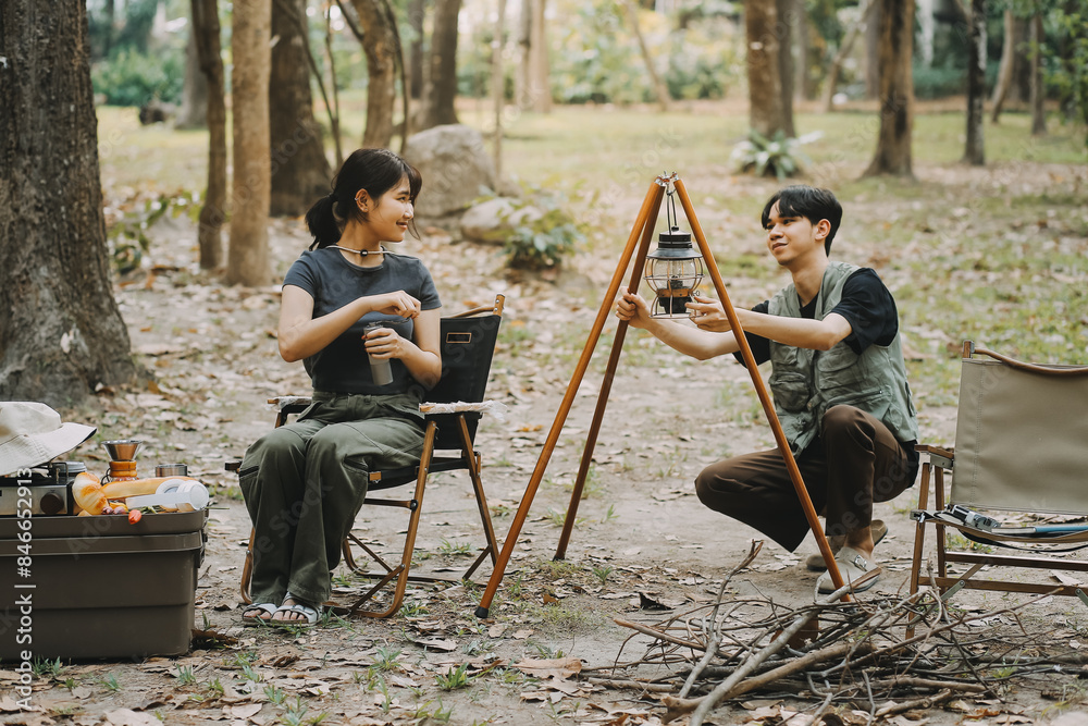 Asian couple sweet in tent inside on they camping trip, traveller relax and sleep togather in out door and camping trip Asian couple sweet in tent inside on they camping trip, traveller relax and sleep togather in out door and camping trip