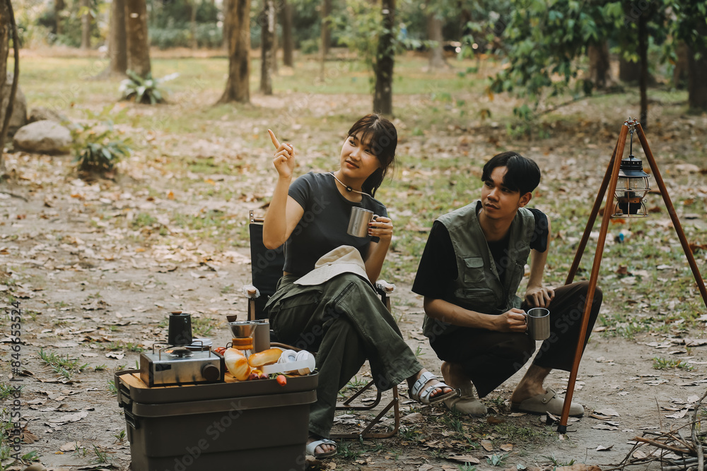 Asian couple sweet in tent inside on they camping trip, traveller relax and sleep togather in out door and camping trip Asian couple sweet in tent inside on they camping trip, traveller relax and sleep togather in out door and camping trip
