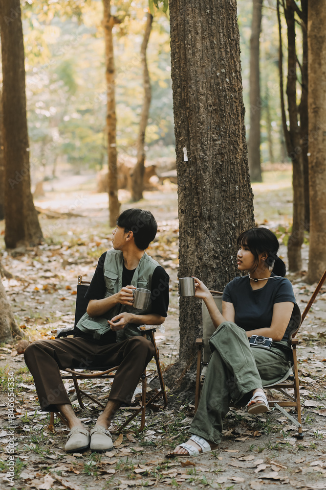 Asian couple sweet in tent inside on they camping trip, traveller relax and sleep togather in out door and camping trip Asian couple sweet in tent inside on they camping trip, traveller relax and sleep togather in out door and camping trip