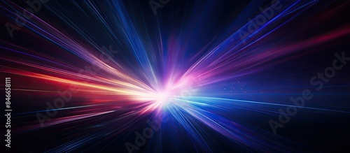 Abstract design of vibrant light leak on dark backdrop, captured with a long lens creating an optical lens flare, with copy space image.