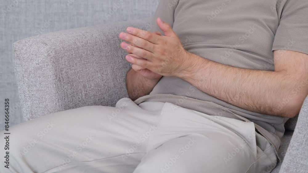 man scratching his hand man scratching his hand