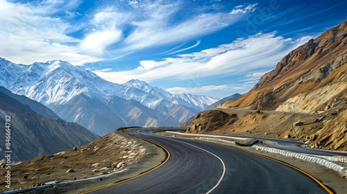 Scenic mountain road under clear blue sky with winding asphalt path in high-altitude region. Beautiful natural landscape ideal for travel promotions and adventure. AI