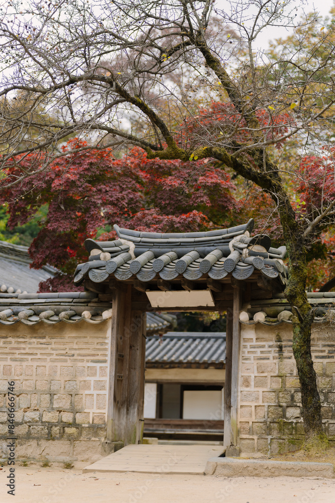 a traditional Korean pavilion with a tiled roof and green window details, set amidst lush trees in Changdeokgung Palace’s Biwon Garden, Seoul. a traditional Korean pavilion with a tiled roof and green window details, set amidst lush trees in Changdeokgung Palace’s Biwon Garden, Seoul.