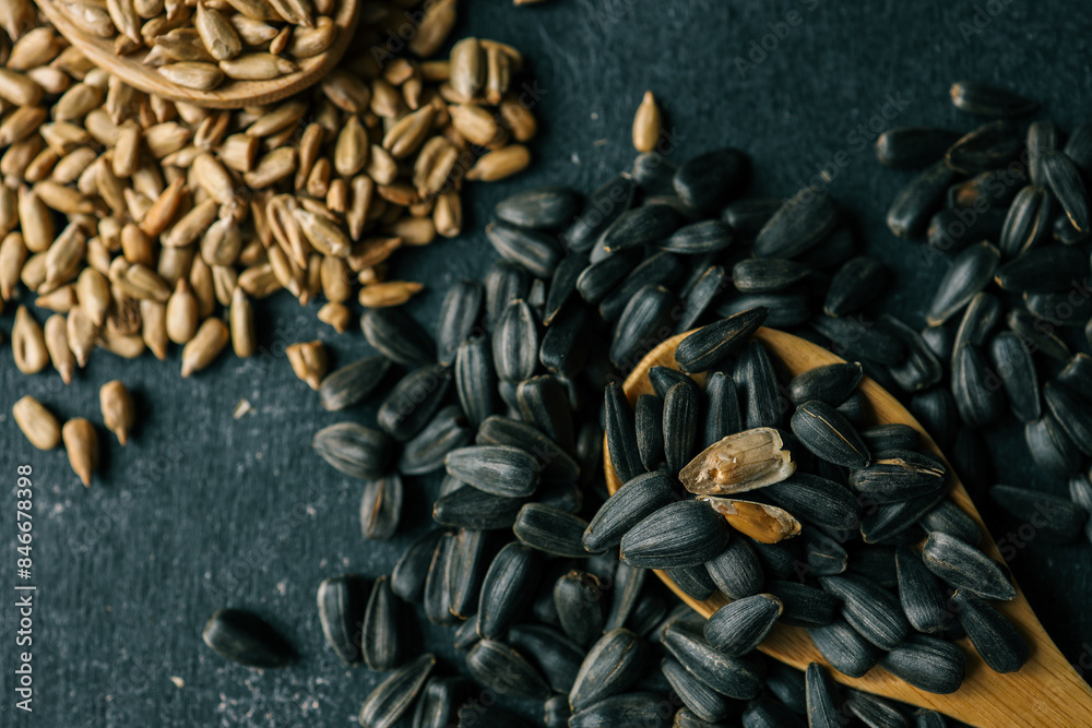 Assortment of sunflower grains, black background Assortment of sunflower grains, black background