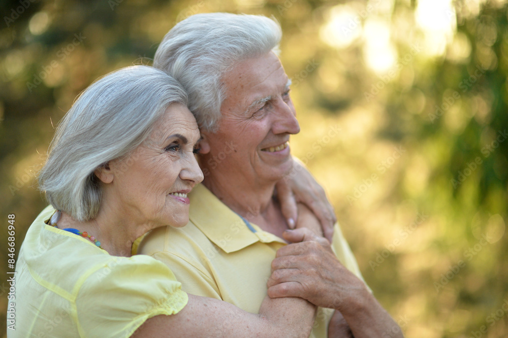 Loving mature couple in the park in summer Loving mature couple in the park in summer