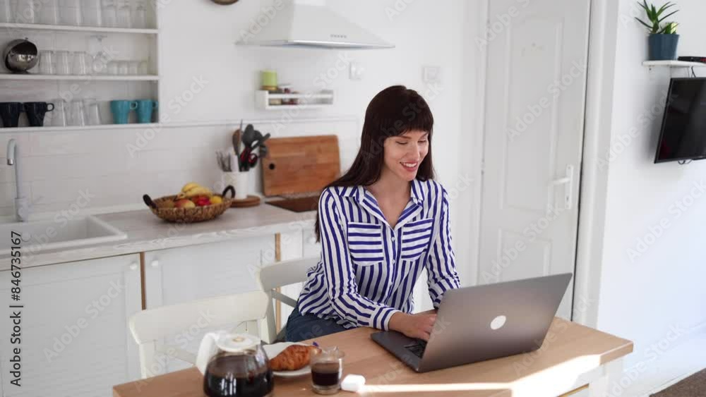 Happy young woman enjoying her online work Happy young woman enjoying her online work