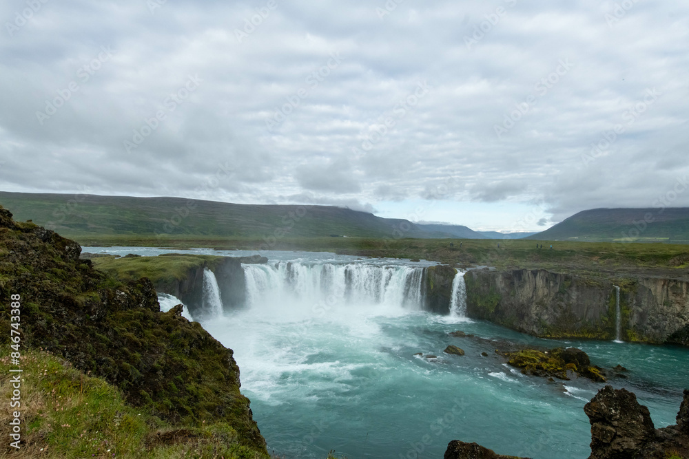 Icelandic landscape of the body of water, lakes and waterfall on a cloudy day from Akureyri Icelandic landscape of the body of water, lakes and waterfall on a cloudy day from Akureyri