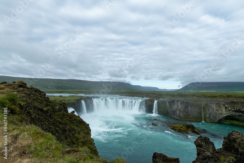 Iceland Akureyri landcape with waterfall on the river on a sunny day