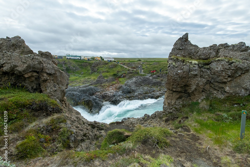 Iceland Akureyri landcape with waterfall on the river on a sunny day