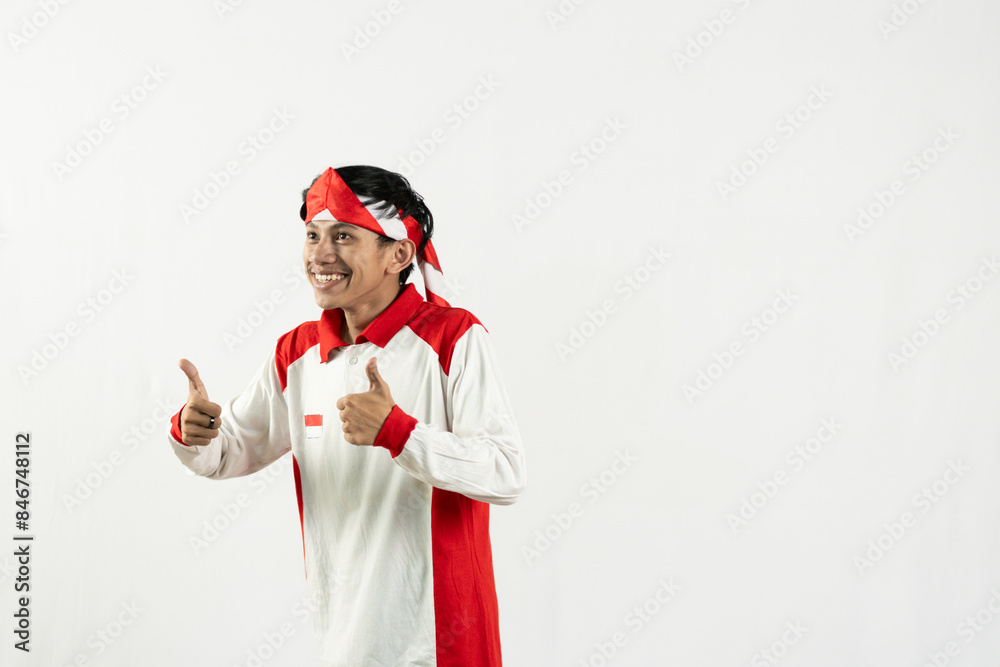 asian young man posing with his index finger, celebrating independence day 17 august, independence day concept, isolated white background. the man's hand is raised in a thumbs-up gesture
