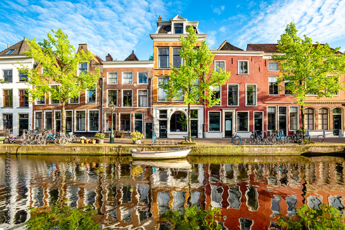 Traditional Dutch brick buildings on the riverside in Leiden, Netherlands