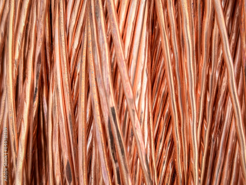 Aligned copper wires displaying consistent patterns and detailed textures in a parallel arrangement. Aligned copper wires displaying consistent patterns and detailed textures in a parallel arrangement.