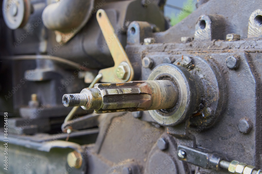 disassembled tractor shaft,tractor repair, tractor transmission shaft, tractor dirty in black oil disassembled tractor shaft,tractor repair, tractor transmission shaft, tractor dirty in black oil