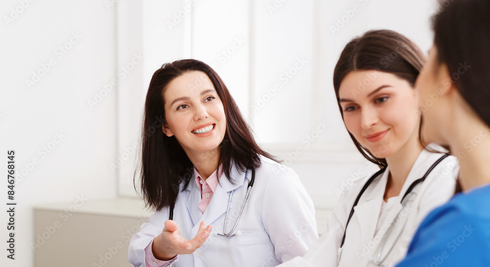 Medical Education. Interns With Mentor Meeting And Taking Notes At Hospital Medical Education. Interns With Mentor Meeting And Taking Notes At Hospital
