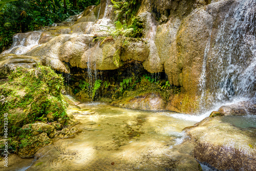 Fototapeta Naklejka Na Ścianę i Meble -  Konoko Falls in Jamaica known for its 4 different sets of falls and ,multi-step formation, with pristine lakes and streams.