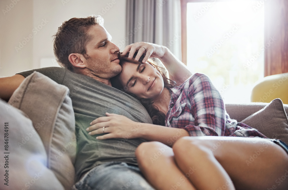 Home, relax and couple on sofa with hug for commitment, support and bonding together in marriage. Calm, peace and man with affection to woman in living room for happiness, comfort and care on weekend Home, relax and couple on sofa with hug for commitment, support and bonding together in marriage. Calm, peace and man with affection to woman in living room for happiness, comfort and care on weekend