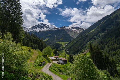 alpine houses on the edge of forest, wooden cabin next to the path, on the raodside, while hiking, we come across old alpine three stage farming huts, hiking in the mountains from Vorarlberg