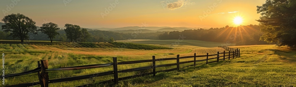 A picturesque sunset over a pastoral scene with grazing cattle. A picturesque sunset over a pastoral scene with grazing cattle.