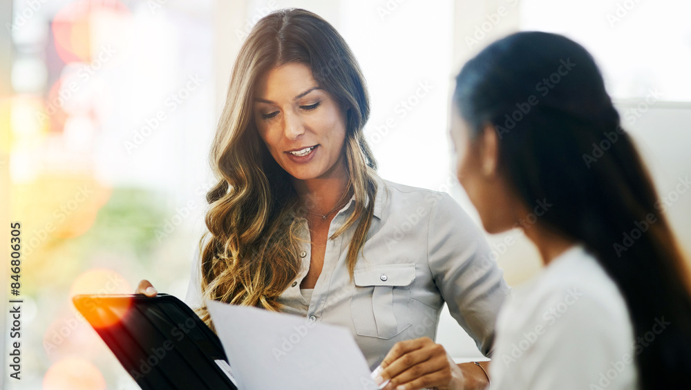 Business women, tablet and meeting in office with discussion, planning and paperwork for feedback. Manager, employee and documents in workplace for review, conversation and strategy with report Business women, tablet and meeting in office with discussion, planning and paperwork for feedback. Manager, employee and documents in workplace for review, conversation and strategy with report