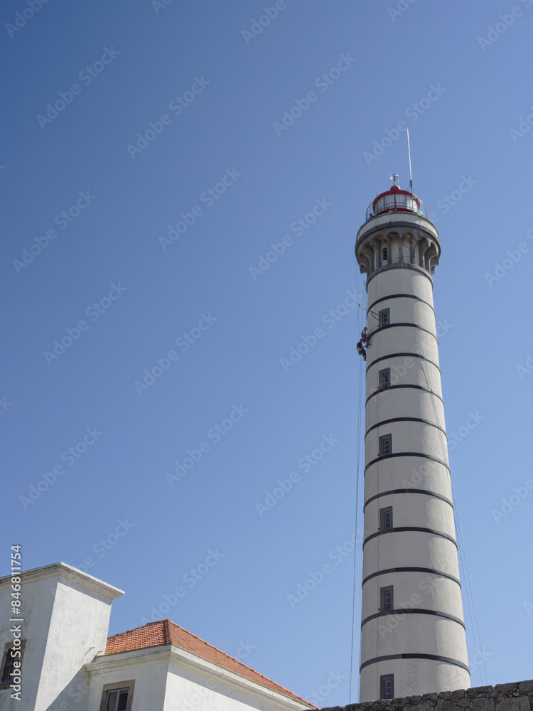Lighthouse maintenance by professional climbers Lighthouse maintenance by professional climbers