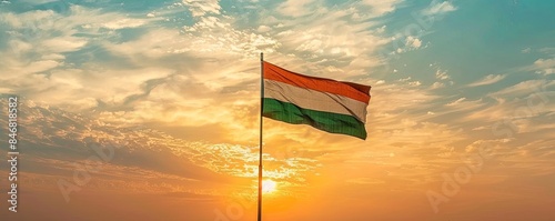 Niger flag flying against a bright sky photo