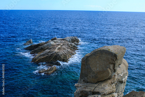 Guardianes atemporales: Rocas gemelas en el mar en Palamós, Girona. photo