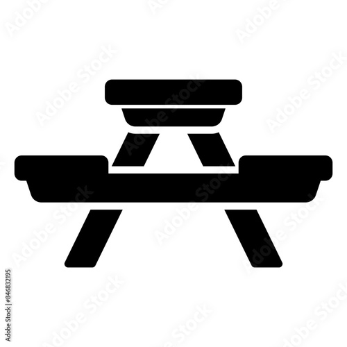 Icon of a wooden picnic table with long chairs