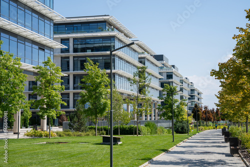 Modern commercial buildings and a beautiful walkway in Europe on a sunny day