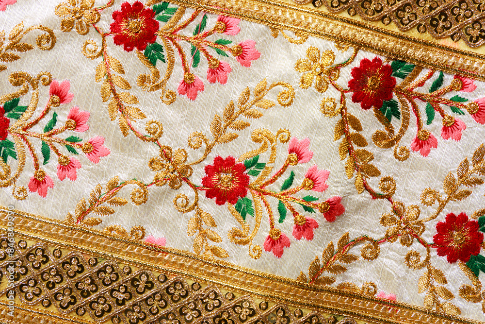 This high-resolution image showcases a detailed view of a traditional Thai sabai, a garment worn as part of the Thai national costume. The fabric features exquisite floral. This high-resolution image showcases a detailed view of a traditional Thai sabai, a garment worn as part of the Thai national costume. The fabric features exquisite floral.
