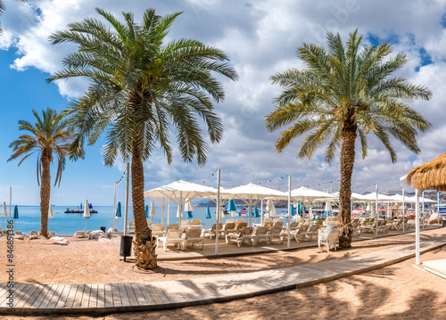Morning on sandy beach of the Red Sea in Eilat - famous tourist resort and re...