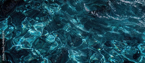 Engaging and natural version: Abstract Closeup of Sunlit Blue Water Surface for Graphic Design