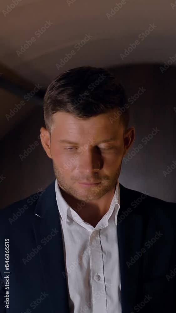 Entrepreneur raising his look to the camera in business jet. Well dressed, confident caucasian businessman turning head to camera in slow motion. Vertical shot. Entrepreneur raising his look to the camera in business jet. Well dressed, confident caucasian businessman turning head to camera in slow motion. Vertical shot.