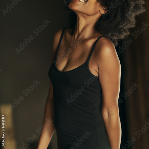 woman in black tank top smiling