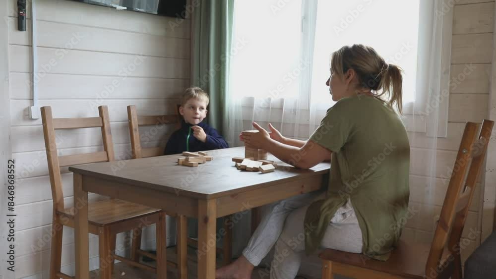 Mother and Son Playing Jenga Game in Their Home