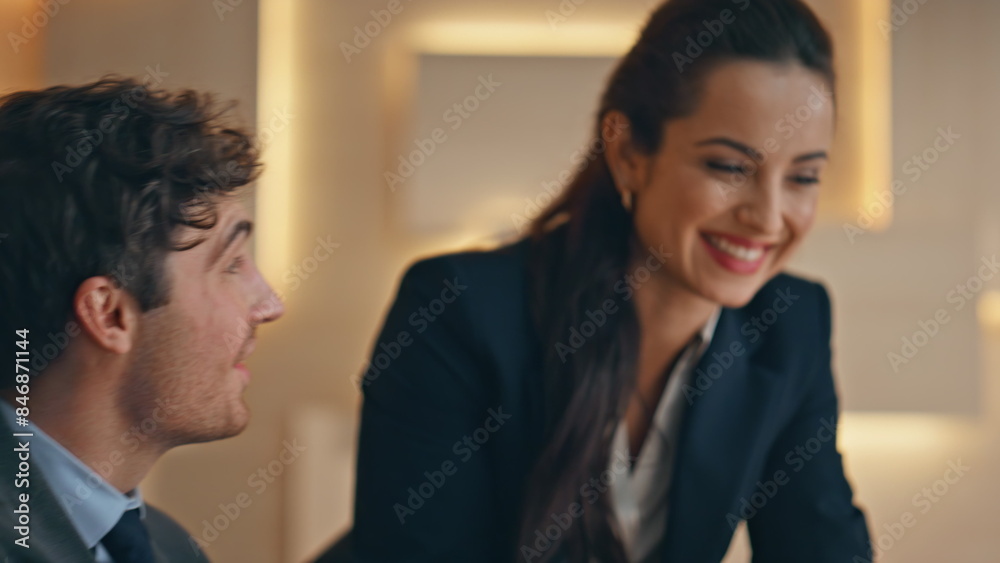 Surprised couple rejoicing business project results at buro closeup. Joyful team Surprised couple rejoicing business project results at buro closeup. Joyful team
