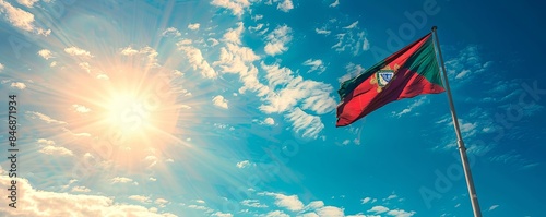 Portugal flag waving against a bright, blue sky photo