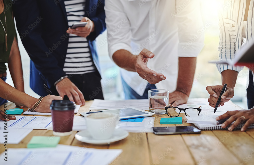 Business people, hands and discussion with documents in collaboration or meeting for project at office. Group of employees in teamwork, conversation or discussing paperwork for brainstorming on desk
