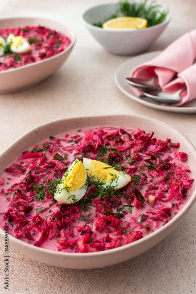 Summer cold beetroot soup made from beets, radishes, cucumbers, potatoes and herbs, garnished with egg, a refreshing summer lunch Summer cold beetroot soup made from beets, radishes, cucumbers, potatoes and herbs, garnished with egg, a refreshing summer lunch