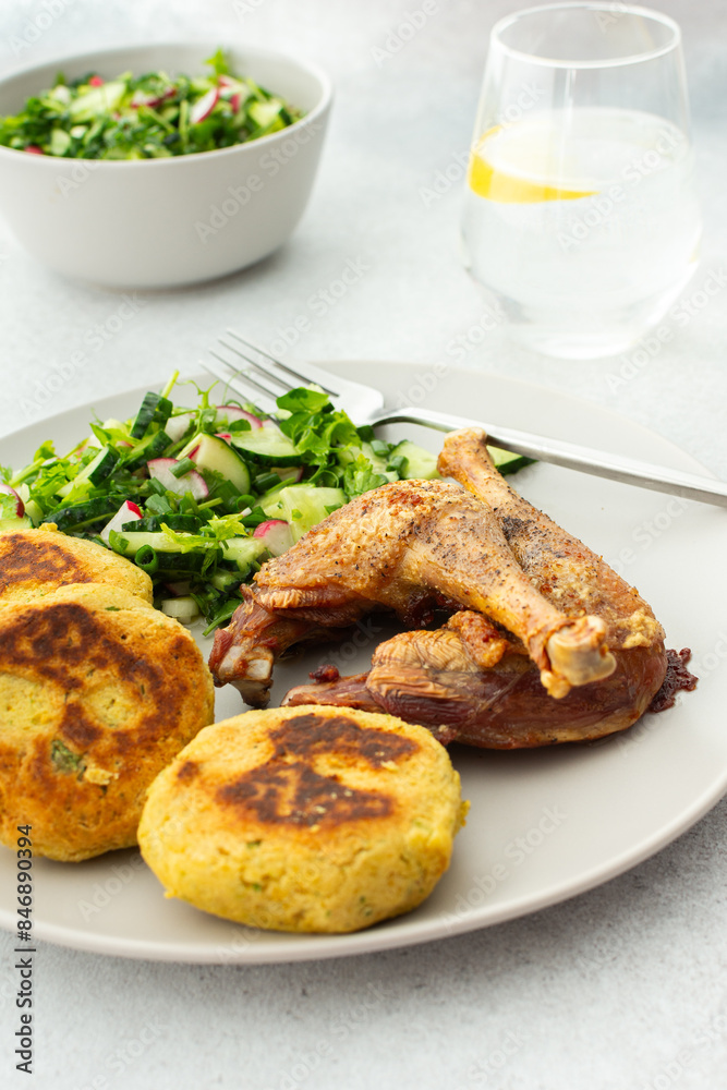 Chickpea cutlets with mixed salad with cucumbers and radishes, baked farm chicken legs, a delicious hearty lunch or dinner Chickpea cutlets with mixed salad with cucumbers and radishes, baked farm chicken legs, a delicious hearty lunch or dinner