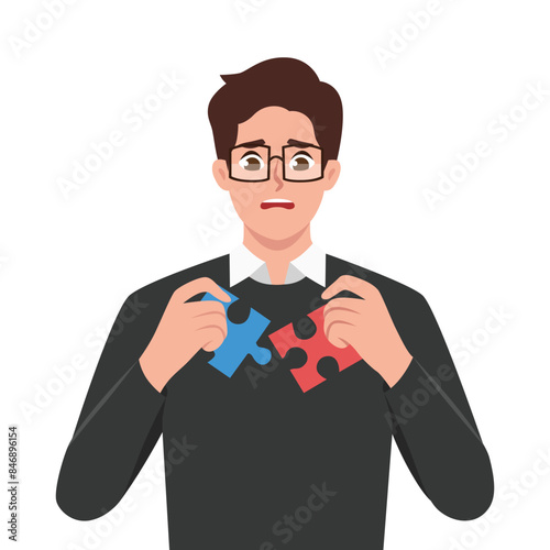 Frustrated young man with jigsaw puzzles in hands rebuild personality. Flat vector illustration isolated on white background