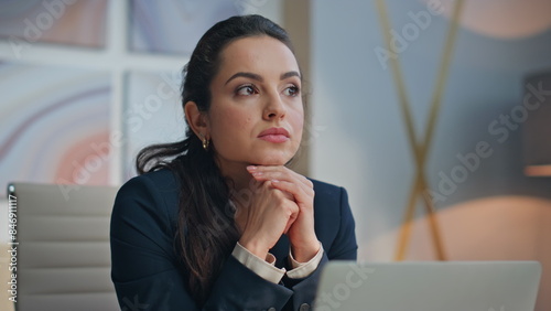 Successful manager thinking business idea at desk closeup. Smiling woman posing