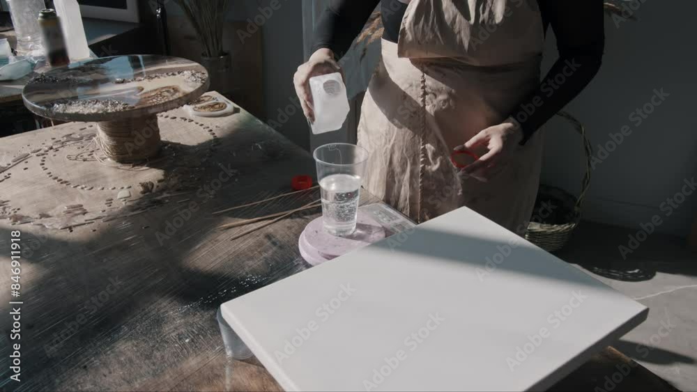 Process of preparing for the creation of an epoxy resin artwork. Mid shot. Process of preparing for the creation of an epoxy resin artwork. Mid shot.