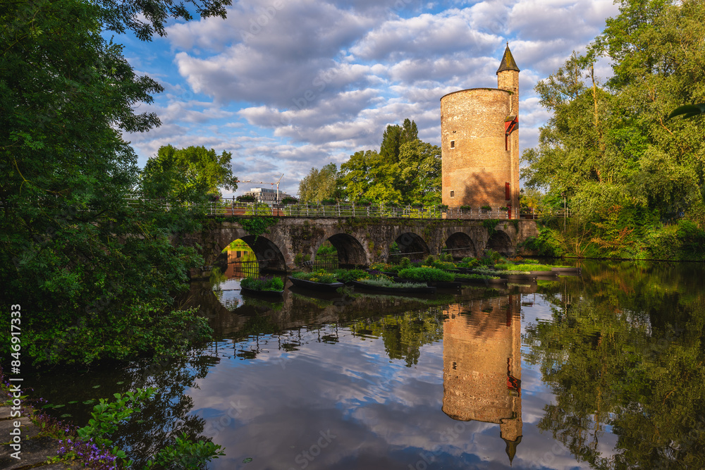 Fototapeta premium Lovers Bridge and Gunpower Tower at Minnewater, Lake of Love, locted in Bruges, Belgium