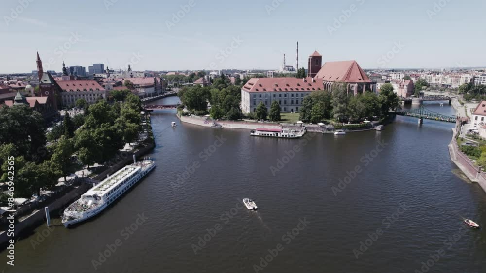 A drone view of Wyspa Piasek and Most Tumski in Wrocław highlights their historic charm and scenic surroundings. A drone view of Wyspa Piasek and Most Tumski in Wrocław highlights their historic charm and scenic surroundings.