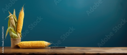 An ear of corn and a pen pl...