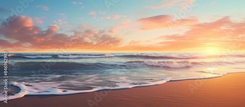 Sunset view of the sea from the sandy beach with waves gently crashing on the shore. with copy space image. Place for adding text or design