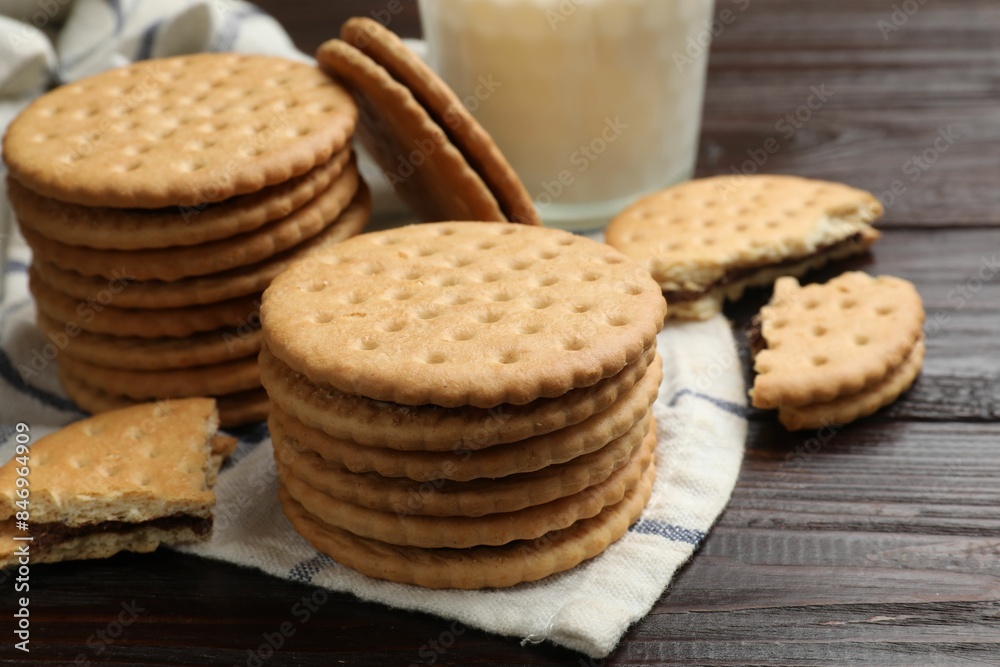 Tasty sandwich cookies on wooden table, closeup Tasty sandwich cookies on wooden table, closeup