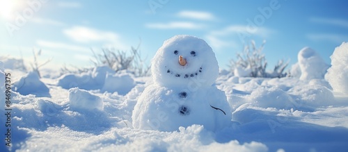 Snowman standing tall in sn...